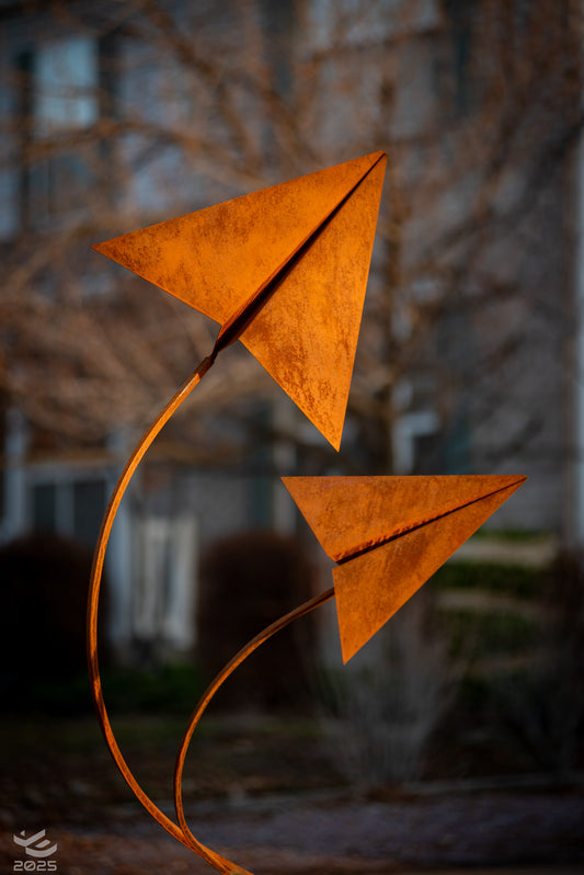 Origami airplanes taking flight - Geometric metal sculpture